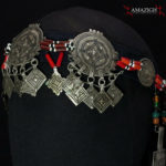Mid 20th century. Silver (niello decorations), coral, agate and glass beads on cotton band; grams 155,8 (5.50 oz.). The piece is cm. 74,0 in lenght (29.13″); the decorated part is cm. 37,0 in lenght (14.57″).  Berbers are the indigenous ethnic group of North Africa. They are continuously distributed from the Atlantic to the Siwa oasis in Egypt, and from the Mediterranean to the Niger River. The name Berber appeared for the first time after the end of the Roman Empire. Many Berbers call themselves some variant of the word imazighen (singular: Amazigh), possibly meaning “free people” or “free and noble men”. Today, most Berber-speaking people live in Morocco and Algeria.  morr21