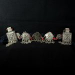 Mid 20th century. Silver (niello decorations), coral, agate and glass beads on cotton band; grams 155,8 (5.50 oz.). The piece is cm. 74,0 in lenght (29.13″); the decorated part is cm. 37,0 in lenght (14.57″).  Berbers are the indigenous ethnic group of North Africa. They are continuously distributed from the Atlantic to the Siwa oasis in Egypt, and from the Mediterranean to the Niger River. The name Berber appeared for the first time after the end of the Roman Empire. Many Berbers call themselves some variant of the word imazighen (singular: Amazigh), possibly meaning “free people” or “free and noble men”. Today, most Berber-speaking people live in Morocco and Algeria.  morr21
