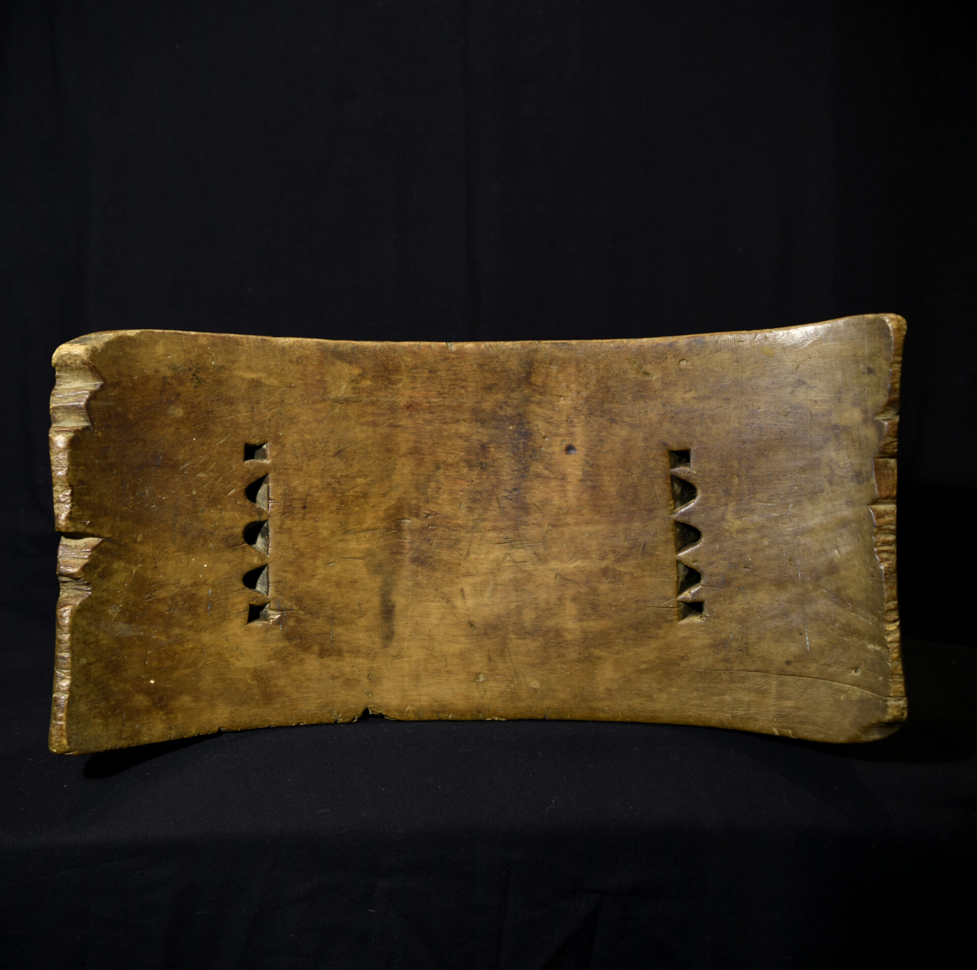 I am writing to let you know that I have this Qua terracotta headrest from the Calabar region, Nigeria. It is a beautiful piece with a fine, aged patina, likely dating to the 18th century.
